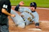Milwaukee Brewers' Avisail Garcia scores on a single by Tyrone Taylor off Pittsburgh Pirates relief pitcher Chasen Shreve during the seventh inning of a baseball game in Pittsburgh, Wednesday, July 28, 2021. (AP Photo/Gene J. Puskar)