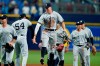 New York Yankees' Aaron Judge, center, celebrates with relief pitcher Aroldis Chapman, second from left, after the team defeated the Tampa Bay Rays during a baseball game Wednesday, July 28, 2021, in St. Petersburg, Fla. (AP Photo/Chris O'Meara)