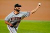 Arizona Diamondbacks starting pitcher Madison Bumgarner throws to a Texas Rangers batter during the first inning of a baseball game in Arlington, Texas, Wednesday, July 28, 2021. (AP Photo/Tony Gutierrez)