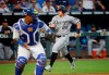 Chicago White Sox's Andrew Vaughn (25) heads for home plate to score during the fifth inning of a baseball game against the Kansas City Royals at Kauffman Stadium in Kansas City, Mo., Wednesday, July 28, 2021. (AP Photo/Colin E. Braley)