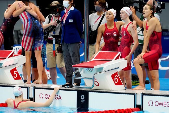 Canada's Penny Oleksiak, left to right, Kayla Sanchez, Summer McIntosh and Rebecca Smith react to their fourth place finish in the women's 4x200m swimming final event during the Tokyo Summer Olympic Games, in Tokyo, Wednesday, July 28, 2021. THE CANADIAN PRESS/Frank Gunn