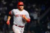 Cincinnati Reds' Joey Votto rounds the bases after hitting a two-run home run off Chicago Cubs relief pitcher Cory Abbott during the ninth inning of a baseball game Wednesday, July 28, 2021, in Chicago. (AP Photo/Charles Rex Arbogast)