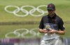 Canadian golfer Corey Conners, from Listowel, Ont. consults his notes on the 10th green at the Kasumigaseki Country Club during the first day of play at the Tokyo Summer Olympic Games, in Kawagoe, Japan, Thursday, July 29, 2021. THE CANADIAN PRESS/Adrian Wyld