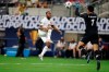 Canada forward Junior Hoilett (10) kicks the ball over the reach of Costa Rica goalkeeper Esteban Alvarado (1) to score in the first half of a CONCACAF Gold Cup quarterfinals soccer match, Sunday, July 25, 2021, in Arlington, Texas. THE CANADIAN PRESS/AP/Brandon Wade