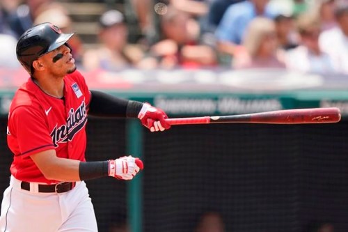 Cleveland Indians' Cesar Hernandez watches his two-run home run in the third inning of a baseball game against the St. Louis Cardinals, Wednesday, July 28, 2021, in Cleveland. (AP Photo/Tony Dejak)