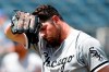 Chicago White Sox pitcher Carlos Rodon reacts to the heat during the fifth inning of a baseball game against the Kansas City Royals at Kauffman Stadium in Kansas City, Mo., Thursday, July 29, 2021. (AP Photo/Colin E. Braley)