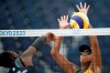 Ana Patricia Silva Ramos, right, of Brazil, blocks a shot by Brackcides Khadambi, of Kenya, during a women's beach volleyball match at the 2020 Summer Olympics, Monday, July 26, 2021, in Tokyo, Japan. (AP Photo/Felipe Dana)