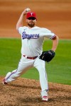 Texas Rangers closer Ian Kennedy throws to an Arizona Diamondbacks during the ninth inning of a baseball game in Arlington, Texas, Tuesday, July 27, 2021. (AP Photo/Tony Gutierrez)