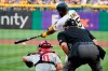 Pittsburgh Pirates' Gregory Polanco, top right, singles off Philadelphia Phillies starting pitcher Vince Velasquez, driving in a run, during the first inning of a baseball game in Pittsburgh, Friday, July 30, 2021. (AP Photo/Gene J. Puskar)