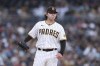 San Diego Padres starting pitcher Ryan Weathers reacts after walking Colorado Rockies' C.J. Cron during the first inning of a baseball game Friday, July 30, 2021, in San Diego. (AP Photo/Derrick Tuskan)