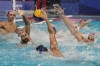 Croatia's Marko Macan (2) and Maro Jokovic (5) defend against Serbia's Strahinja Rasovic (7) during a preliminary round men's water polo match at the 2020 Summer Olympics, Saturday, July 31, 2021, in Tokyo, Japan. (AP Photo/Mark Humphrey)
