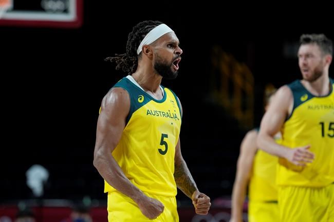Australia's Patty Mills (5) celebrates after a score against Germany during a men's basketball preliminary round game at the 2020 Summer Olympics, Saturday, July 31, 2021, in Saitama, Japan. (AP Photo/Eric Gay)
