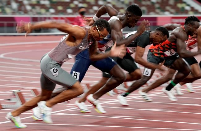 Canada's Andre De Grasse competes in the men's 100m heats event during the Tokyo Summer Olympic Games, in Tokyo, Saturday, July 31, 2021. De Grasse cruised into the semifinals of the men's 100 metres, winning his heat in a season-best time of 9.91 seconds. THE CANADIAN PRESS/Frank Gunn