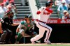 Los Angeles Angels designated hitter Shohei Ohtani, right, hits an RBI-double with Oakland Athletics catcher Sean Murphy, center, watching with home plate umpire Tripp Gibson, left, during the third inning of a baseball game in Anaheim, Calif., Saturday, July 31, 2021. (AP Photo/Alex Gallardo)