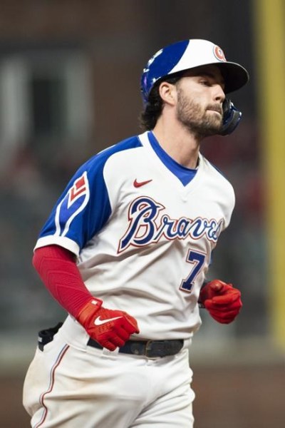 Atlanta Braves' Dansby Swanson rounds bases after hitting a grand slam during the bottom of the seventh inning of a baseball game against the Milwaukee Brewers, Saturday, July 31, 2021, in Atlanta. (AP Photo/Hakim Wright Sr.)