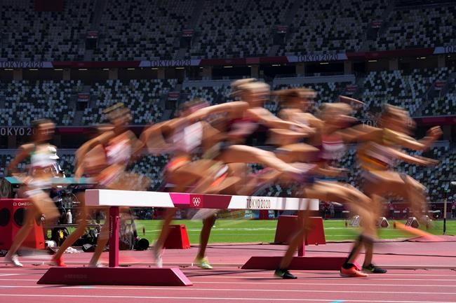 Runners compete in a heat of the women's 3,000-meter steeplechase at the 2020 Summer Olympics, Sunday, Aug. 1, 2021, in Tokyo. (AP Photo/Petr David Josek)