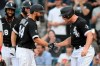 Chicago White Sox's Seby Zavala (44) celebrates at home plate with Adam Engel right, after hitting a grand slam during the fourth inning of the team's baseball game against the Cleveland Indians on Saturday, July 31, 2021, in Chicago. (AP Photo/Paul Beaty)