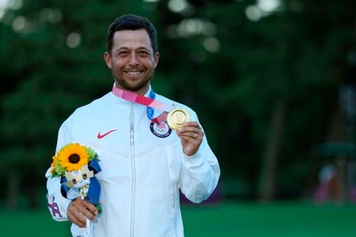 Xander Schauffele, of the United States, holds his gold medal in the men's golf at the 2020 Summer Olympics on Sunday, Aug. 1, 2021, in Kawagoe, Japan. (AP Photo/Andy Wong)