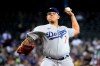 Los Angeles Dodgers pitcher Julio Urias throws against the Arizona Diamondbacks in the first inning during a baseball game, Sunday, Aug 1, 2021, in Phoenix. (AP Photo/Rick Scuteri)