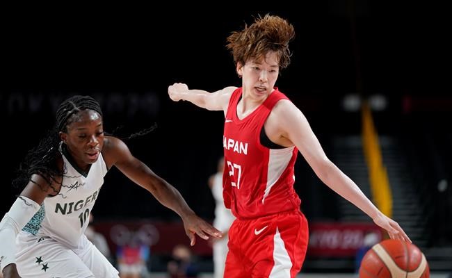 Japan's Saki Hayashi (27), right, steals the ball from Nigeria's Promise Amukamara (10), left, during women's basketball preliminary round game at the 2020 Summer Olympics, Monday, Aug. 2, 2021, in Saitama, Japan. (AP Photo/Charlie Neibergall)