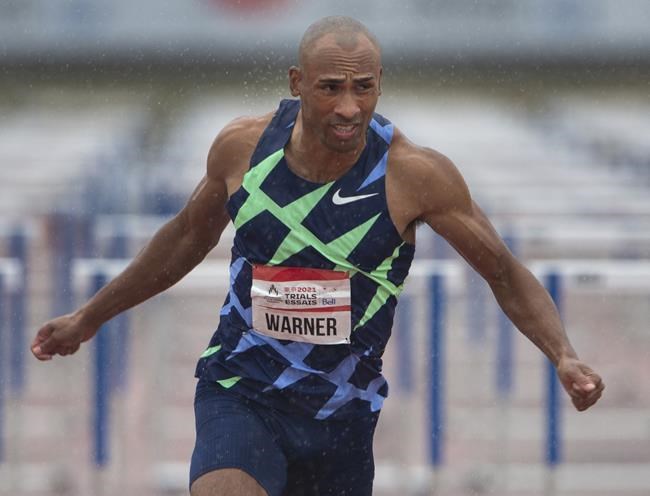Damian Warner crosses the finish line to win the Men’s 110m hurdles final at the Canadian Track and Field Olympic trials, in Montreal, Saturday, June 26, 2021. THE CANADIAN PRESS/Ryan Remiorz