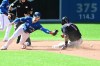 Cleveland Indians’ Ahmed Rosario, right, slides safely into second base as Toronto Blue Jays’ Cavan Biggio misses the ball in the fifth inning of a baseball game against the Cleveland Indians, in Toronto on Monday, August 2, 2021. Rosario would advance to third base on the play. THE CANADIAN PRESS/Jon Blacker