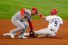 Los Angeles Angels shortstop Jose Iglesias, left, catches a throw to the bag as Texas Rangers' Isiah Kiner-Falefa steals second base in the fifth inning of a baseball game in Arlington, Texas, Monday, Aug. 2, 2021. (AP Photo/Tony Gutierrez)