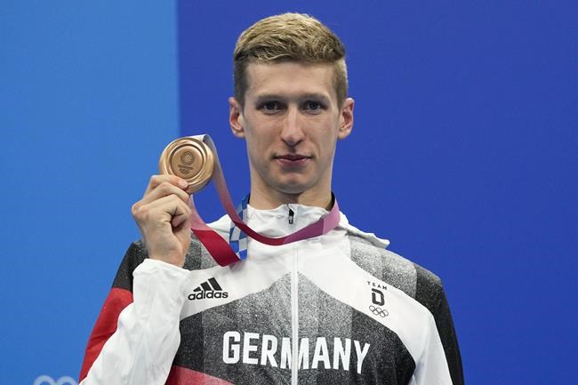 Florian Wellbrock, of Germany, celebrates after winning the bronze medal in a men's 1500-meter freestyle final at the 2020 Summer Olympics, Sunday, Aug. 1, 2021, in Tokyo, Japan. (AP Photo/Gregory Bull)