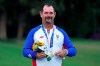 Silver medal winner Rory Sabbatini, of Slovakia, stands on the podium after the men's golf event at the 2020 Summer Olympics, Sunday, Aug. 1, 2021, at the Kasumigaseki Country Club in Kawagoe, Japan, (AP Photo/Andy Wong)