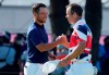 CORRECTS LAST NAME TO SCHAUFFELE FROM SHAUFFELE - Xander Schauffele of the United States, left, is congratulated by Paul Casey of Britain after winning gold in the men's golf event at the 2020 Summer Olympics on Sunday, Aug. 1, 2021, in Kawagoe, Japan. (AP Photo/Andy Wong)