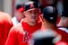 FILE - In this July 31, 2021, file photo, Los Angeles Angels' Mike Trout talks with a teammate before their baseball game against the Oakland Athletics in Anaheim, Calif. Trout missed his 67th game Tuesday night, Aug. 3, since going on the injured list May 18 with a right calf strain. This is only the third time he has been on the injured list in his 11 big league seasons, and his longest stretch missing games. (AP Photo/Alex Gallardo, File)