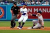 Houston Astros' Kyle Tucker, right, slides into second base with a double next to Los Angeles Dodgers second baseman Mookie Betts during the second inning of a baseball game Tuesday, Aug. 3, 2021, in Los Angeles. (AP Photo/Marcio Jose Sanchez)