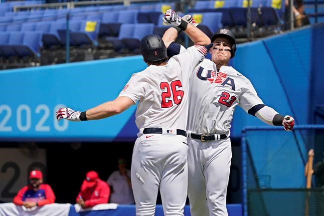 United States' Tyler Austin (23) celebrates his home run with teammate Triston Casas (26) in the fifth inning of a baseball game against the Dominican Republic at the 2020 Summer Olympics, Wednesday, Aug. 4, 2021, in Yokohama, Japan. (AP Photo/Sue Ogrocki)