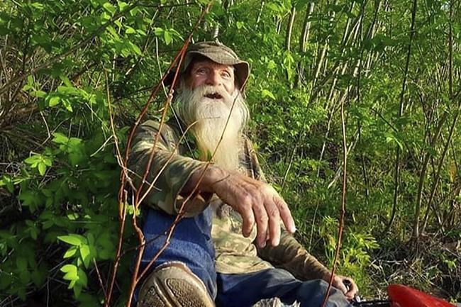 This undated photo provided by Jodie Gedeon shows David Lidstone, 81, who for nearly three decades has lived in the woods of Canterbury, N.H. along the Merrimack River in a shack, growing his own food and cutting his firewood. He's now jailed after not complying with a court order to leave, and there's a growing petition to just let