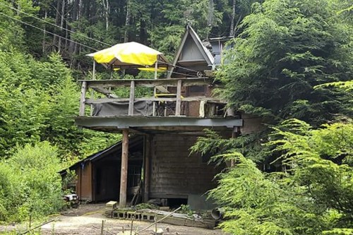 This undated photo provided by Jodie Gedeon shows the shack that David Lidstone, 81, has built and lived in for nearly three decades in the woods of Canterbury, N.H., growing his own food and cutting his firewood. He's now jailed after not complying with a court order to leave, and there's a growing petition to just let 