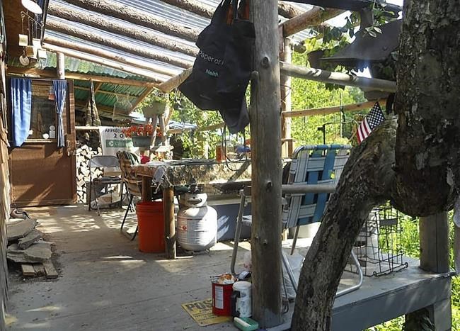 This undated photo provided by Jodie Gedeon shows the shack that David Lidstone, 81, has built and lived in for nearly three decades in the woods of Canterbury, N.H., growing his own food and cutting his firewood. He's now jailed after not complying with a court order to leave, and there's a growing petition to just let