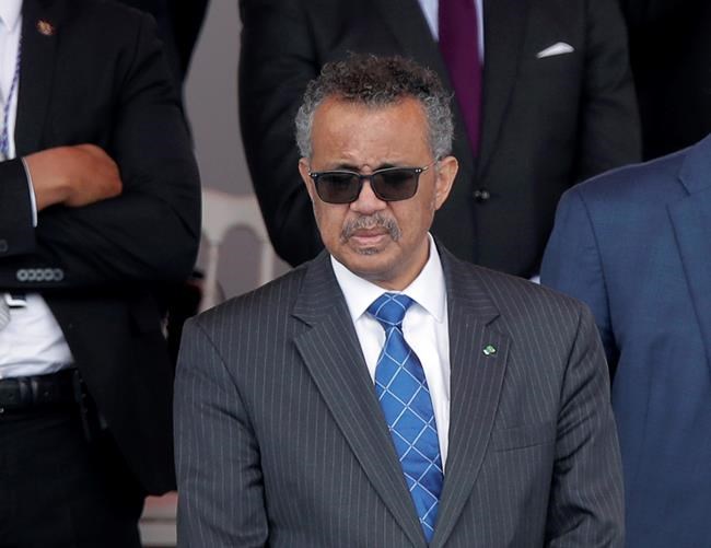 FILE - In this file photo dated Tuesday, July 14, 2020, Director General of the World Health Organization, Tedros Adhanom Ghebreyesus, attends the Bastille Day military parade, in Paris. The head of the World Health Organization has appealed Wednesday Aug. 4, 2021, for a moratorium on administering booster shots of COVID-19 vaccines, to ensure doses are available in countries where few people have yet received their first shots. (AP Photo/Christophe Ena, FILE)