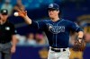 Tampa Bay Rays third baseman Joey Wendle makes a barehanded stop on an infield single by Seattle Mariners' Abraham Toro during the fourth inning of a baseball game Wednesday, Aug. 4, 2021, in St. Petersburg, Fla. (AP Photo/Chris O'Meara)