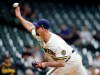 Milwaukee Brewers' John Axford pitches against the Pittsburgh Pirates during the ninth inning of a baseball game Monday, Aug. 2, 2021, in Milwaukee. (AP Photo/Jeffrey Phelps)