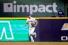 Milwaukee Brewers' John Axford enters a baseball game against the Pittsburgh Pirates during the ninth inning Monday, Aug. 2, 2021, in Milwaukee. (AP Photo/Jeffrey Phelps)
