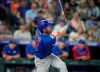 Chicago Cubs' Patrick Wisdom follows the flight of his double to drive in three runs off Colorado Rockies starting pitcher Jon Gray in the fifth inning of a baseball game Wednesday, Aug. 4, 2021, in Denver. (AP Photo/David Zalubowski)