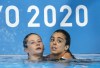 Caeli McKay (left) and Meghan Benfeito comfort each other as they see their fourth place marks in the women’s 10m synchronized diving competition during the Tokyo Olympics in Tokyo, Japan on Tuesday July 27, 2020. THE CANADIAN PRESS/ Frank Gunn