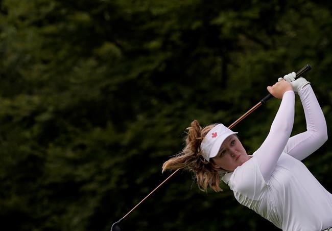 Brooke Henderson, of Canada, watches her tee shot on the second hole during the first round of the women's golf event at the 2020 Summer Olympics, Wednesday, Aug. 4, 2021, at the Kasumigaseki Country Club in Kawagoe, Japan. THE CANADIAN PRESS/AP/Matt York