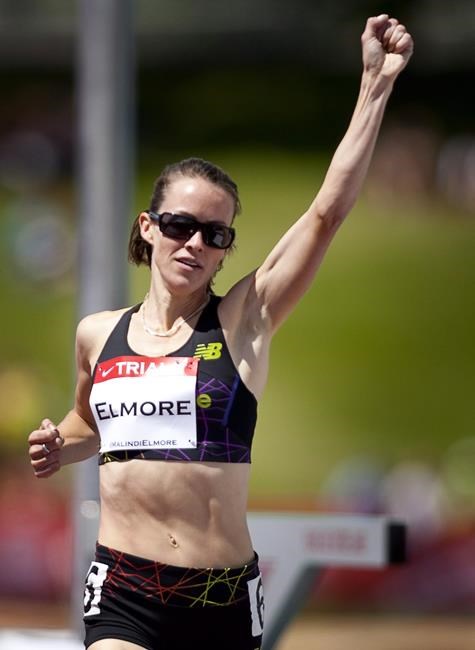 Malindi Elmore, from Kelowna, B.C., celebrates winning in the women's 1,500-metre event at the Canadian Track and Field Championships in Calgary, Alta., Friday, June 29, 2012. THE CANADIAN PRESS/Jeff McIntosh