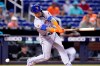 New York Mets' Javier Baez strikes out swinging during the first inning of a baseball game against the Miami Marlins, Thursday, Aug. 5, 2021, in Miami. (AP Photo/Lynne Sladky)