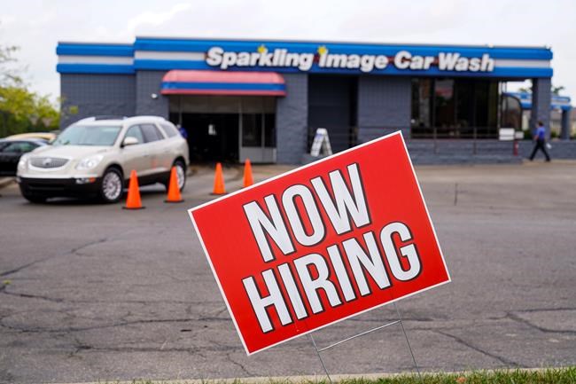 A help wanted sign is displayed at car wash in Indianapolis, Wednesday, Sept. 2, 2020. Statistics Canada will reveal this morning how the labour market fared in July as restrictions meant to quell the COVID-19 pandemic were rolled back in many provinces. THE CANADIAN PRESS/AP-Michael Conroy
