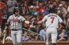 Atlanta Braves' Dansby Swanson, right, is congratulated by Stephen Vogt after scoring a run during the eighth inning of the team's baseball game against the St. Louis Cardinals on Thursday, Aug. 5, 2021, in St. Louis. (AP Photo/Joe Puetz)