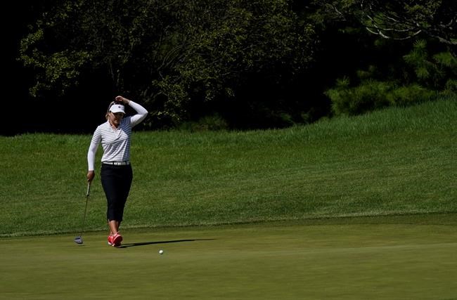 Brooke Henderson of Canada reacts after missing a birdie chance on the 14th green during the second round of the women's golf event at the 2020 Summer Olympics, Thursday, Aug. 5, 2021, at the Kasumigaseki Country Club in Kawagoe, Japan. THE CANADIAN PRESSAP-Matt York
