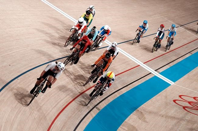 Athletes compete during the track cycling women's madison race at the 2020 Summer Olympics, Friday, Aug. 6, 2021, in Izu, Japan. (AP Photo/Thibault Camus)