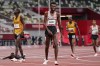 Moh Ahmed of Canada, centre, reacts after winning the silver medal in the Men's 5000m final during the summer Tokyo Olympics in Tokyo, Japan on Friday, August 6, 2021. THE CANADIAN PRESS/Nathan Denette